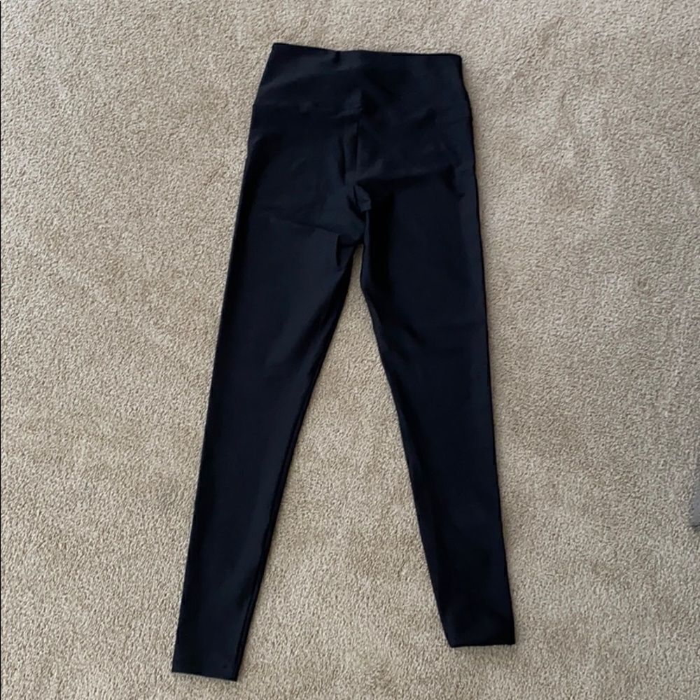 Black size and fit shiny legging.